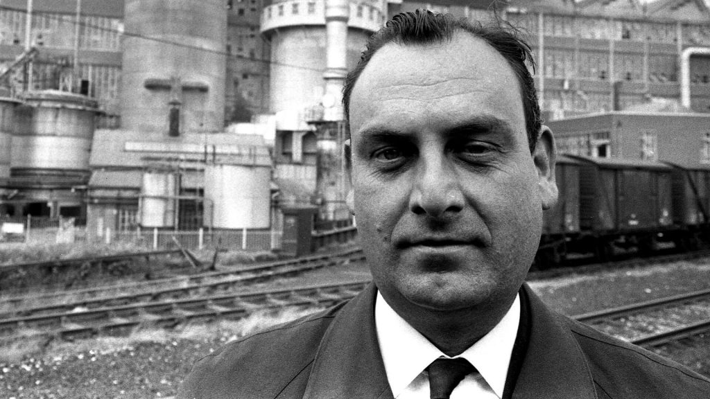 a black and white photo of Ian Nairn